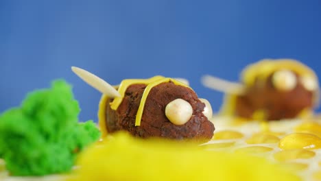 bee-themed cake decorated with honeycomb and chocolate truffles