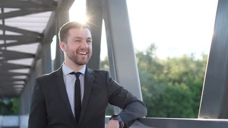 a business manager looks at a smart watch while going to work a business manager looks at a smart watch while going to work young european man in business clothes slow motion