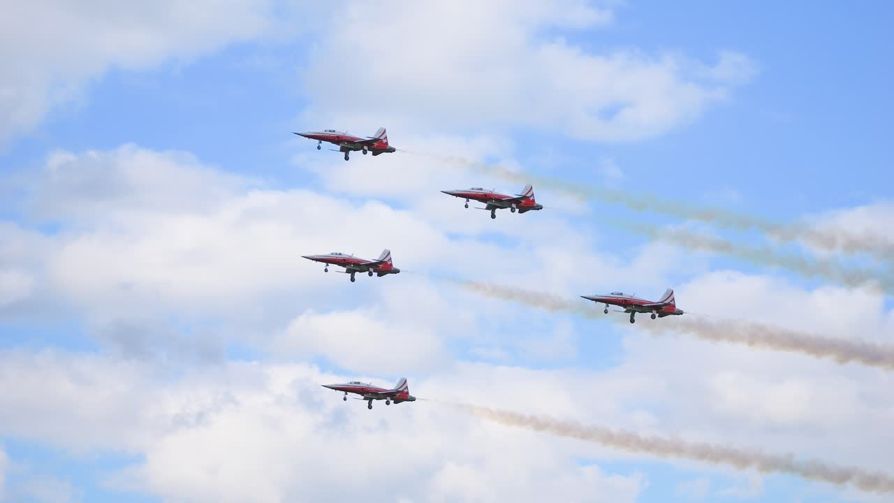 Aircraft squadron of the Swiss Army called Partouille Suisse, does a stunt in slow motion. Recorded at the airshow called airpower 2024