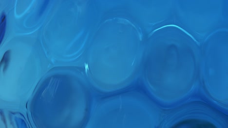 rotating blue glass honeycomb texture looping background