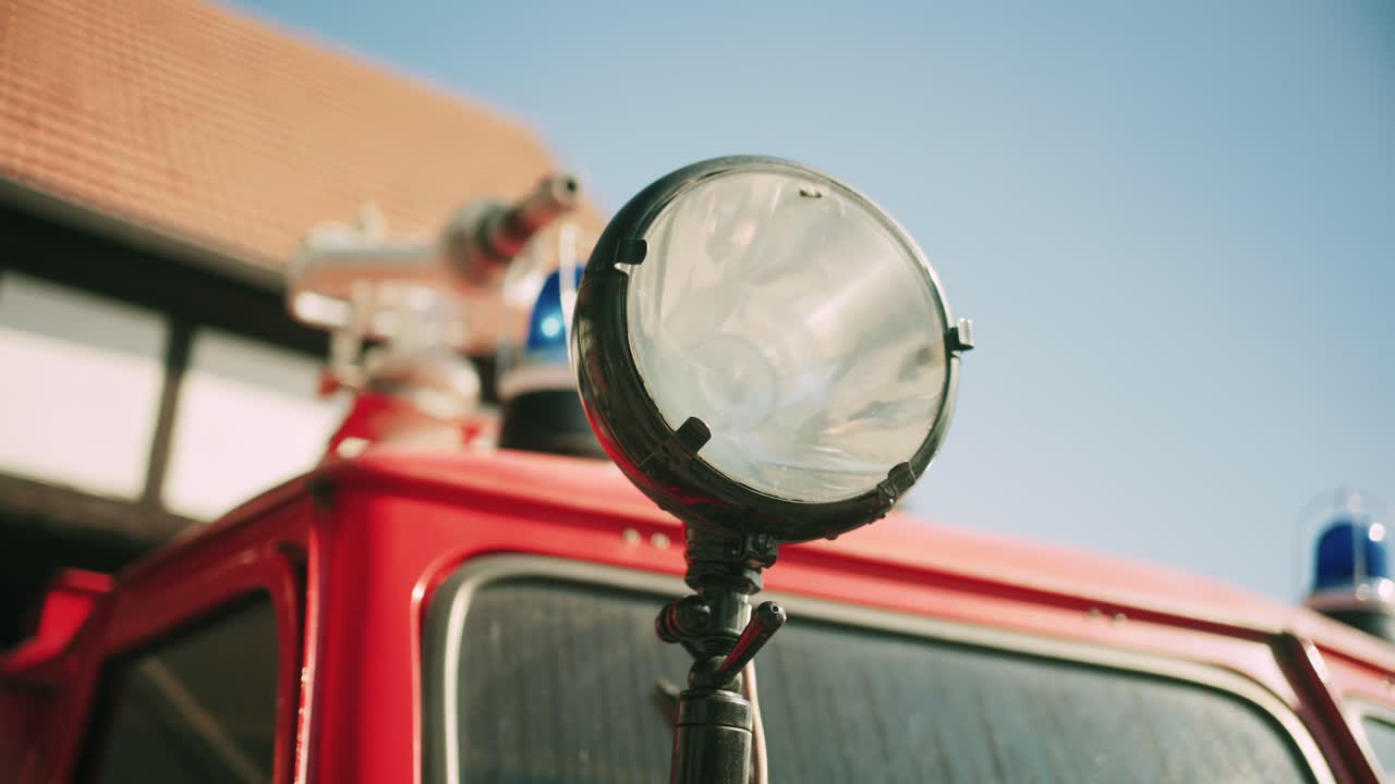 Close-up of a spotlight on a vintage red fire truck