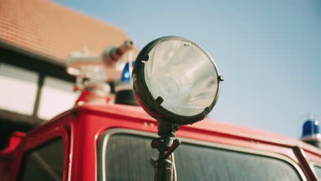 close-up of a spotlight on a vintage red fire truck