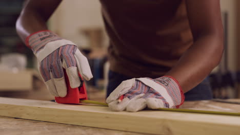 carpenter measuring wood