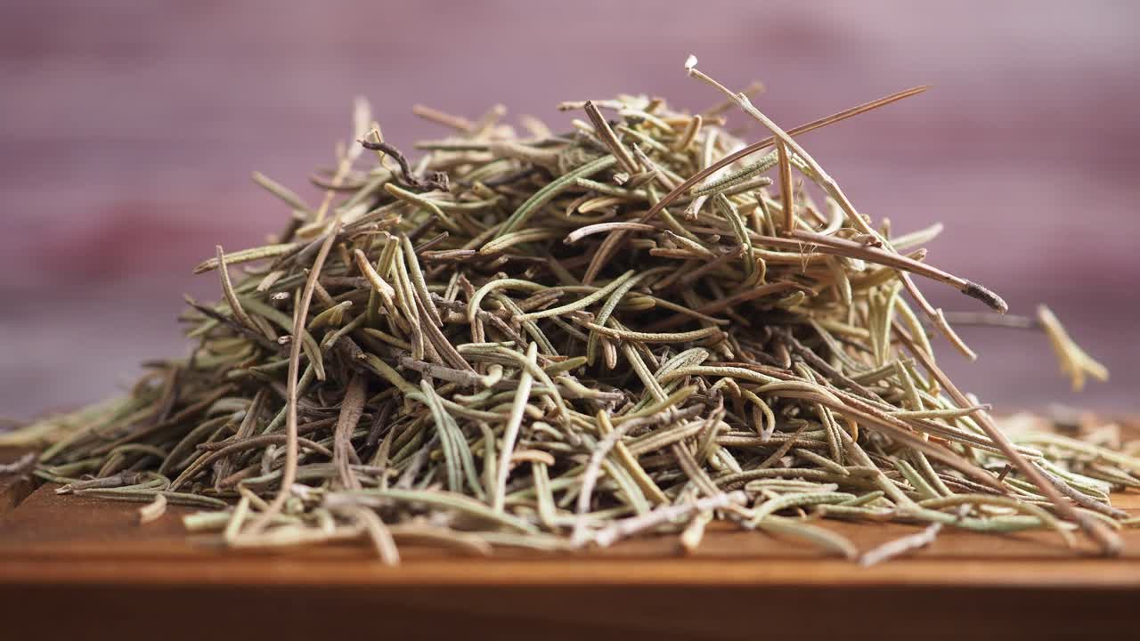 Close-up of Dried Rosemary Herb on a Wooden Surface