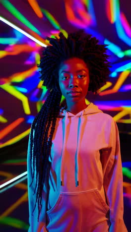 portrait of a young woman in vibrant neon lights