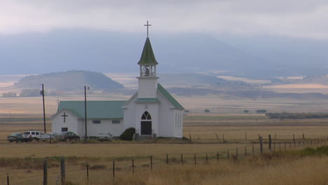 a small church stands on a montana prairie