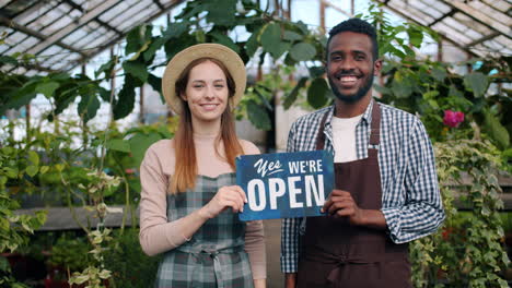 friendly garden center employees greet customers
