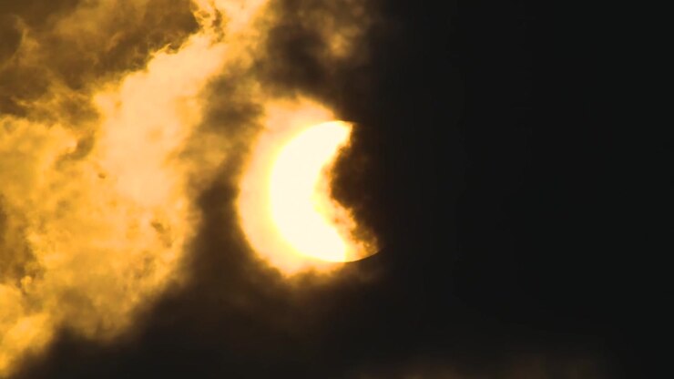 Close up, Bright full moon glow with fast moving dark transparent clouds.