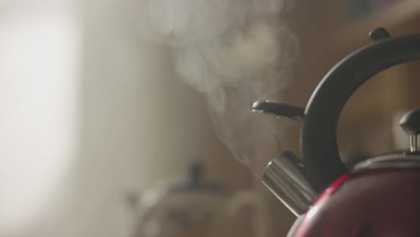 steaming red kettle