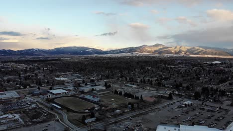 drone shot of small town during sunset in winter