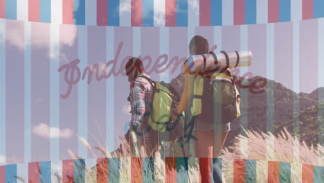 animación del texto del día de la independencia sobre la caminata de una pareja diversa sonriente