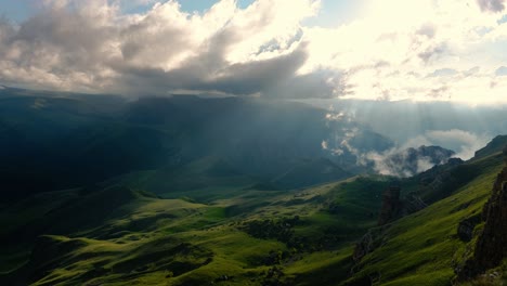 low clouds over a highland plateau in the rays of sunset. sunset on bermamyt plateau north caucasus, karachay-cherkessia, russia.