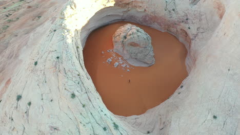 drone aerial view of cosmic ashtray, unique rock formation with sand in utah usa