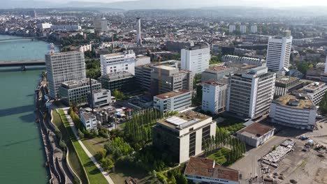 the novartis campus in basel, switzerland, focusing on life sciences, pharmaceutical innovation, and corporate architecture, aerial drone video