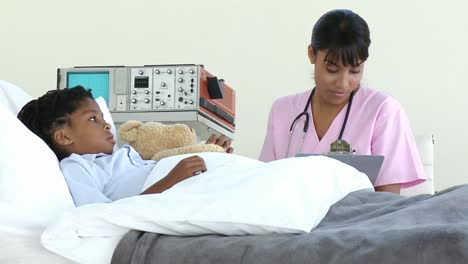 little boy lying on a hospital bed