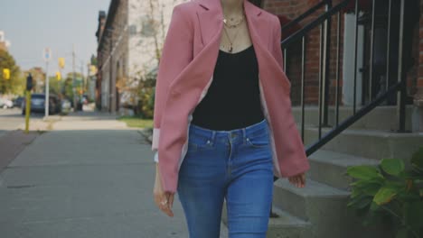 gorgeous female caucasian model showing a runway walk in her blue fitted jeans - slow motion