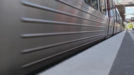 Contemporary-train-starting-and-leaving-platform-of-Elbbrucken-Station-on-sunny-day-in-Hamburg,-Germany