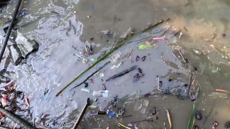 stream of water moving with natural and man-made debris