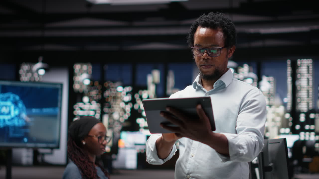 African American Man Using Digital Tablet in Modern Office