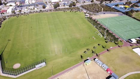 aerial descending view over multi use sports oval, halesworth park, butler