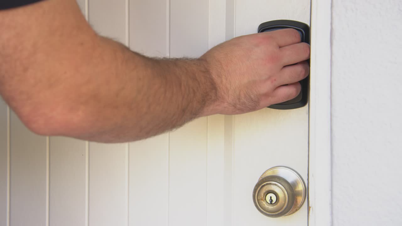 White male entering home with electric key pad