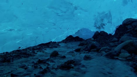 an underground river flows beneath an ice cave