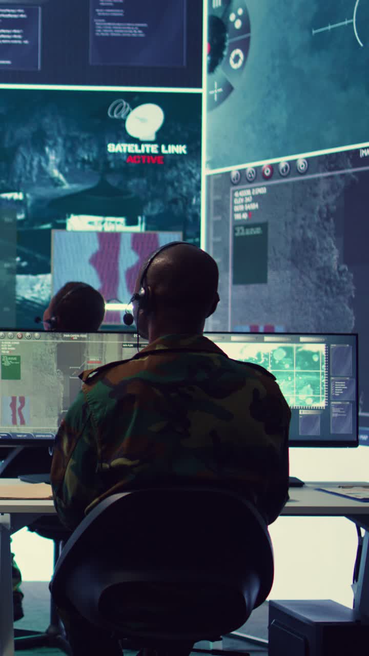 Military Operators Monitoring Surveillance Data in Control Room