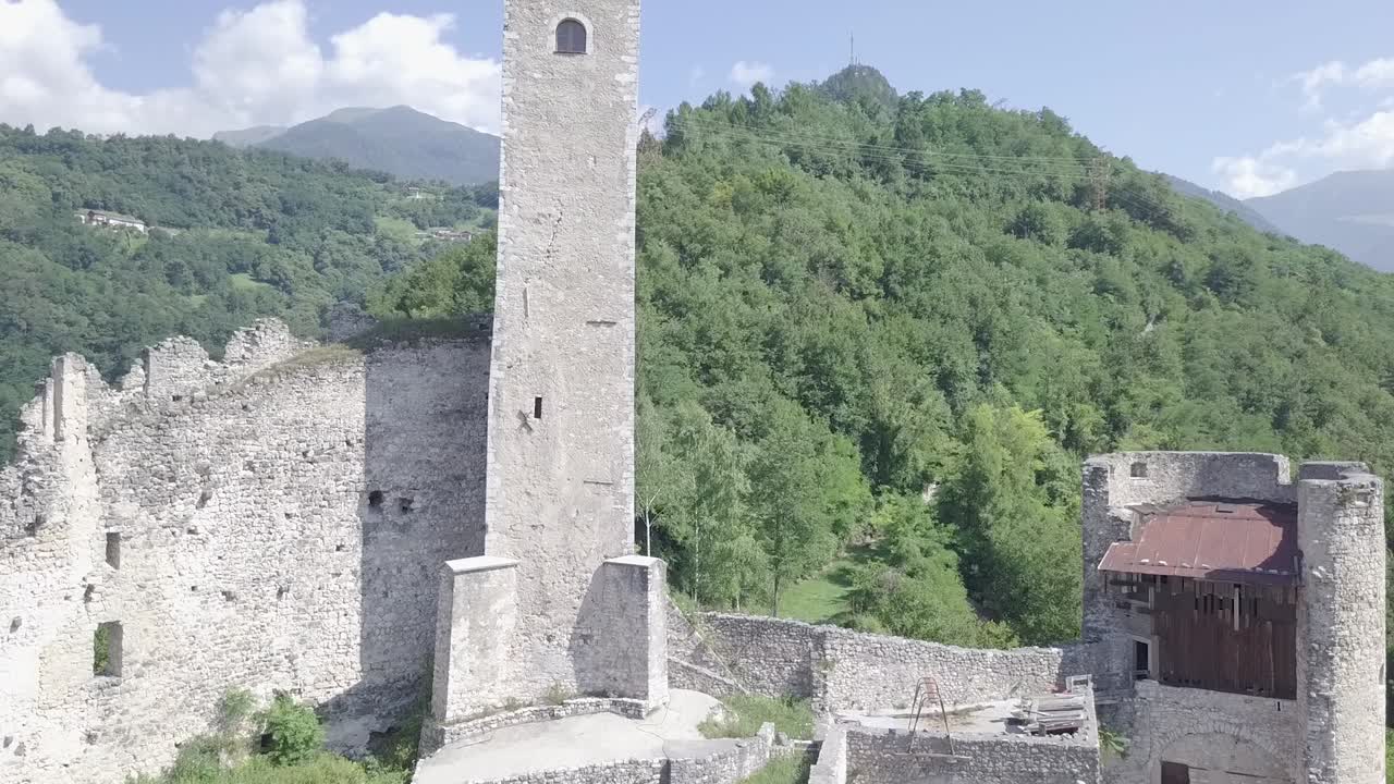 Aerial view of Castel Telvana in Borgo Valsugana, Trentino, Italy with drone flying forward on a very clear day