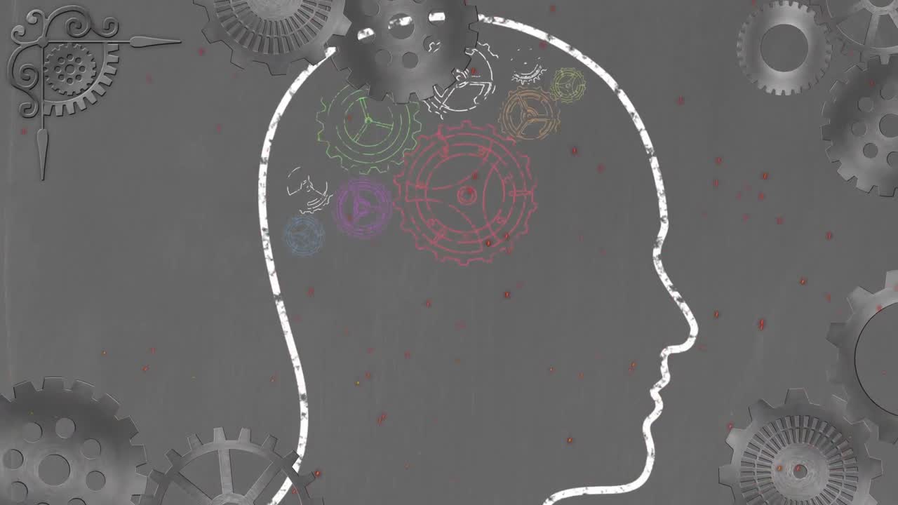 ruedas de engranajes girando sobre la cabeza humana contra un fondo gris