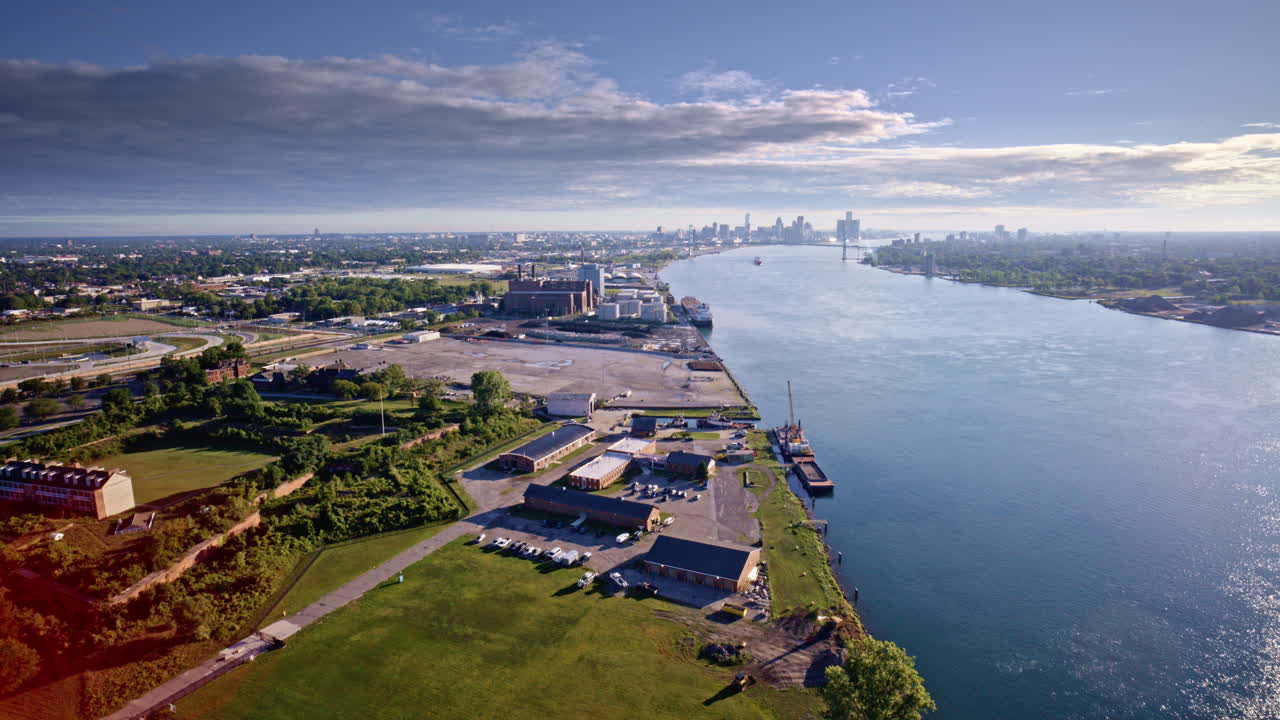 Stunning aerial footage of the Detroit River with a freighter gliding past the downtown skyline