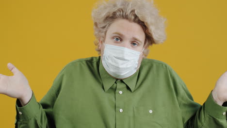 man wearing mask, expressing confusion