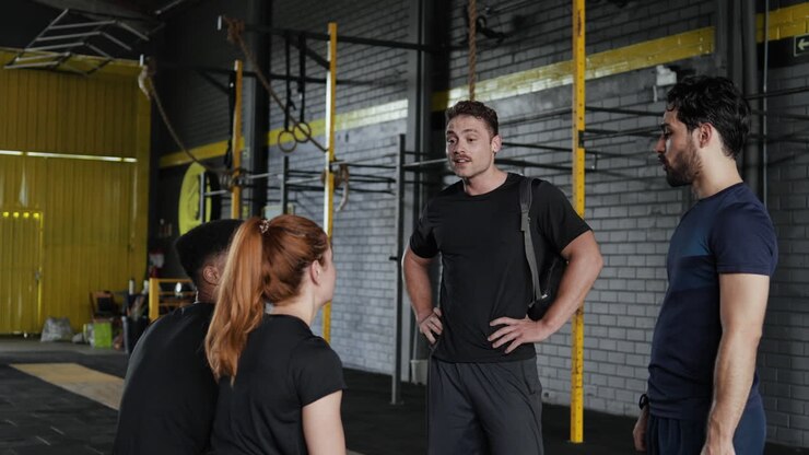 Group of friends enjoying a conversation in a gym
