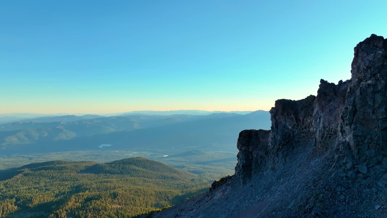 Aerial Flyover Of Frozen Mountain Peaks During Sunrise At Mt Shasta In California, USA