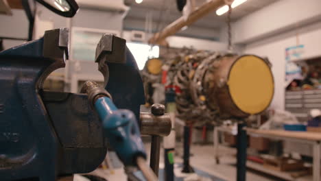 airplane engine in a shop being worked on