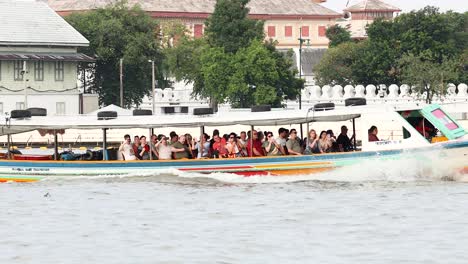 colorful boats navigate the bustling river scene