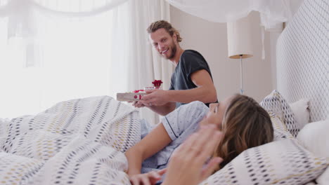 Man-Bringing-Woman-Breakfast-In-Bed-To-Celebrate-Birthday-Or-Valentines-Day