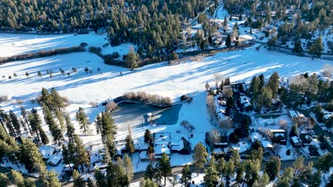 aerial view over big bear lake village with snow, south california, usa