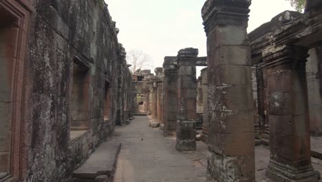 walking through the galleries of a forgotten temple in angkor wat