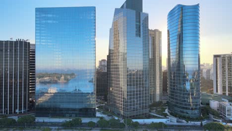 buenos aires city with modern skyscrapers and towers, in central business district with puerto madero reflections the office buildings glass windows, aerial dolly out shot