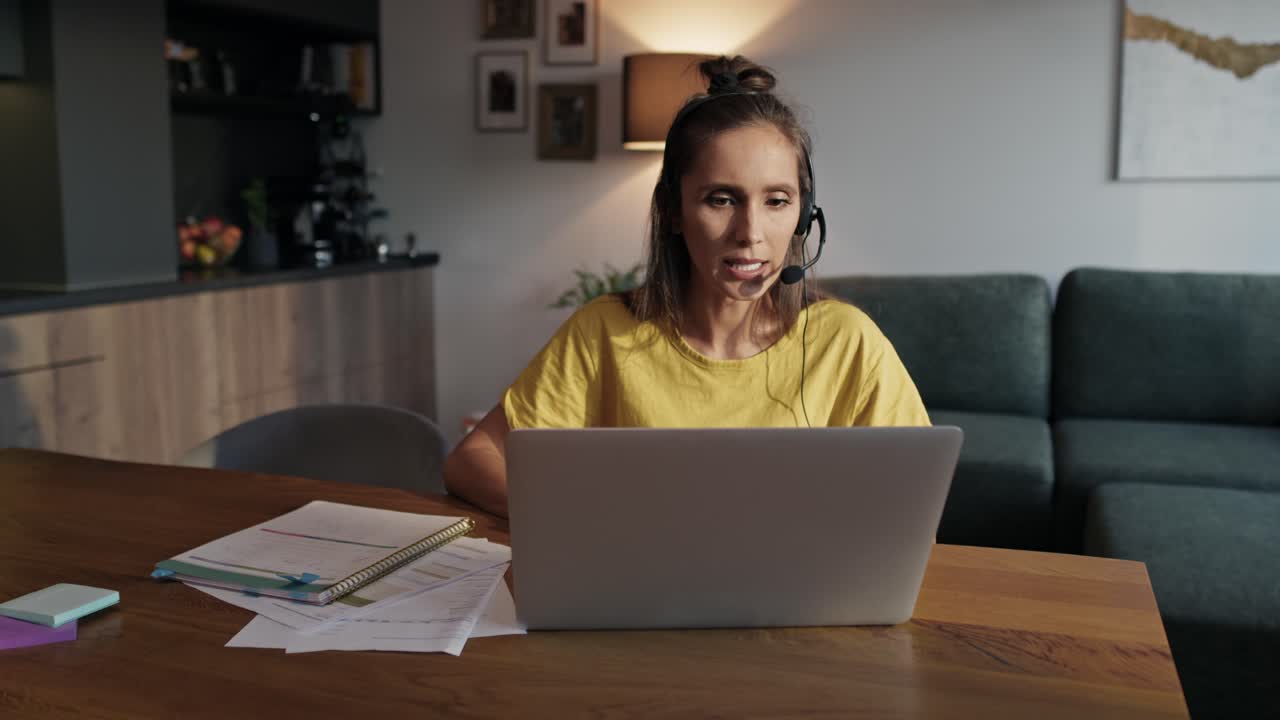 Caucasian woman working as call center at home