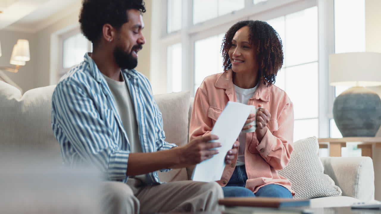 Couple reviewing documents at home