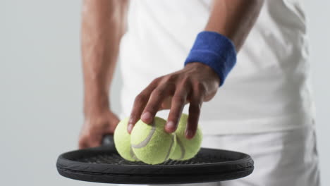 athlete preparing to serve in a tennis match