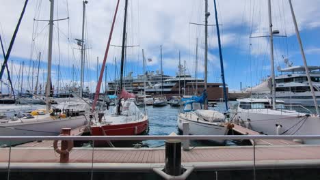 luxury yachts and sailboats in a calm marina