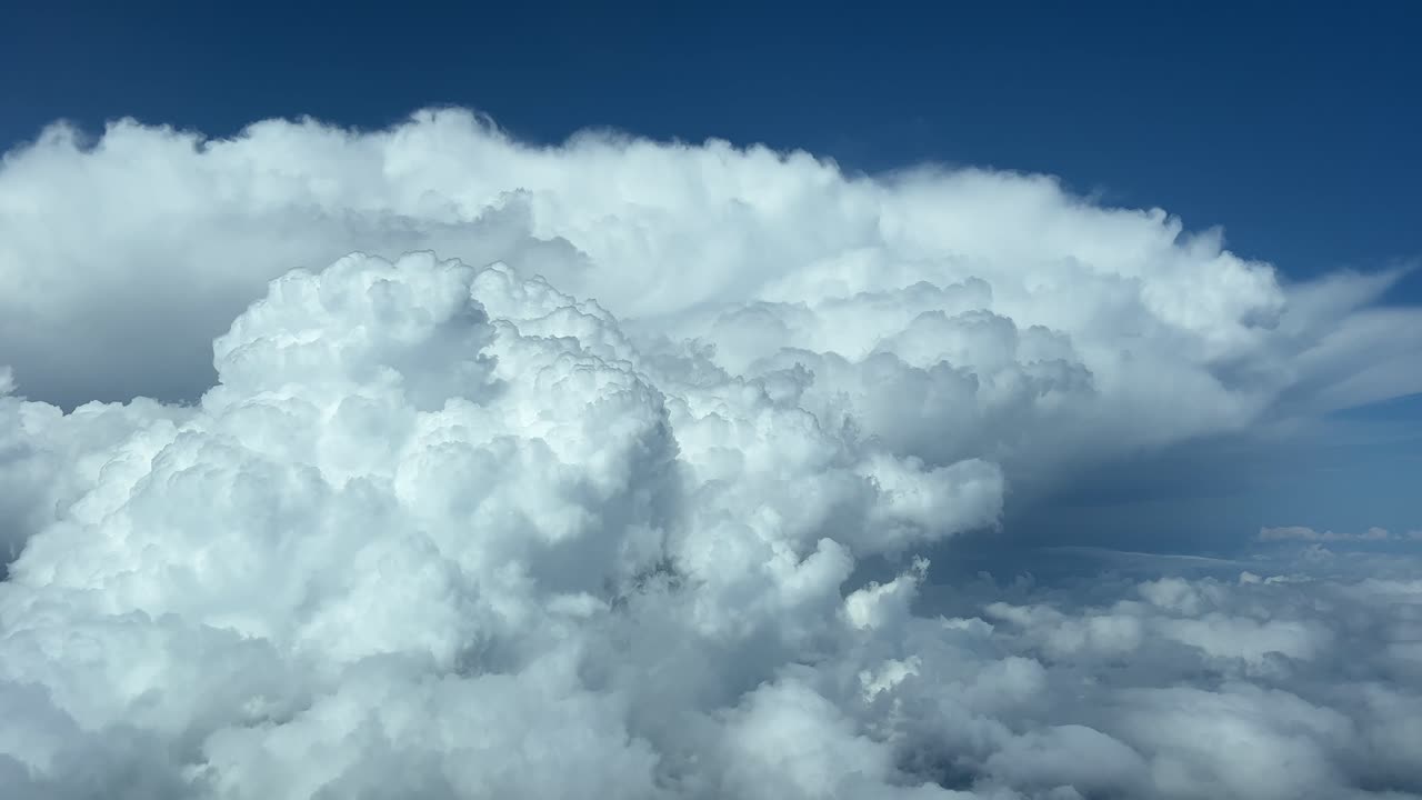 Awesome view of a huge storm cloud recorded from a jet&rsquo;s cabin during cruise level at 12000m high