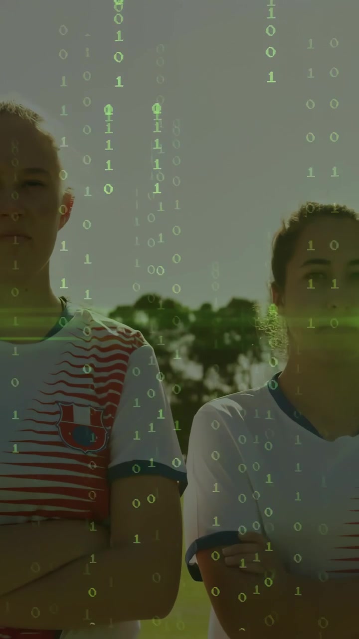 Vertical video: Two players crossed-armed on sports field binary appearing over faces showing stats