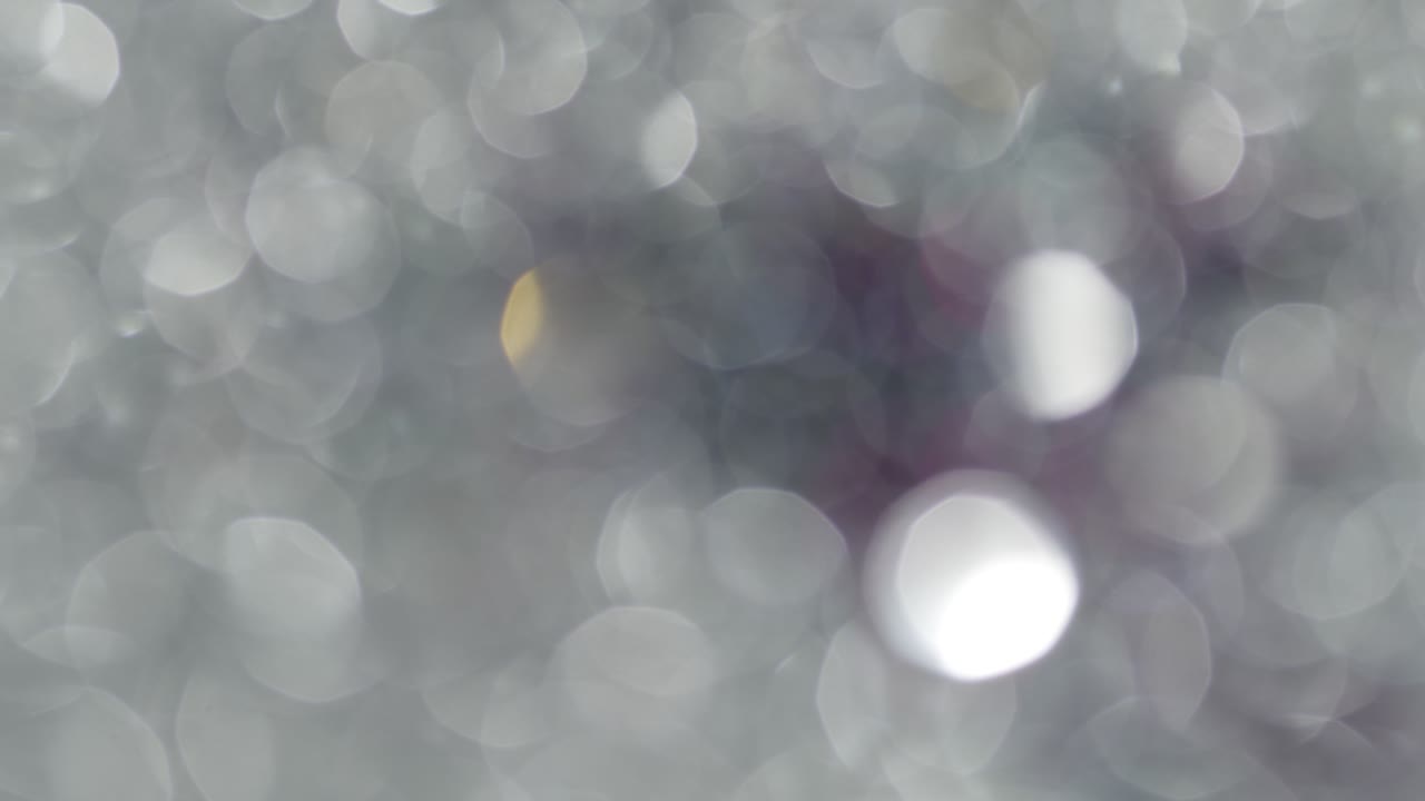 Multicolored light leaks 4k footage on black background. Stylizing video, transitions. Bokeh effect