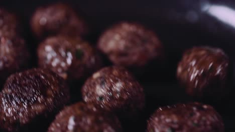 Chef-Cooking-And-Swirling-Meatballs-On-A-Frying-Pan