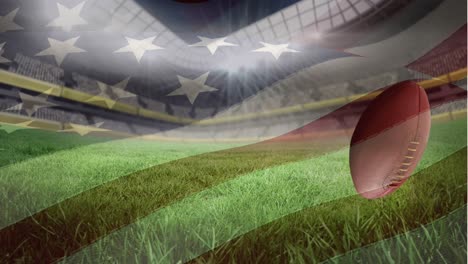 Schwenkende-Amerikanische-Flagge-über-Mehreren-Rugbybällen,-Die-Im-Hintergrund-Gegen-Das-Sportstadion-Fallen