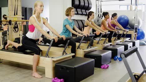 Beautiful-women-exercising-in-fitness-studio