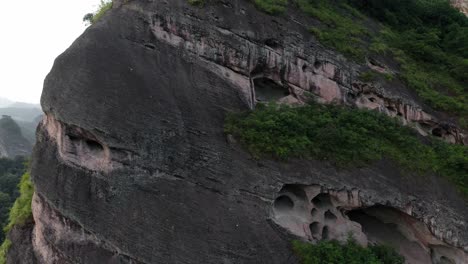 rock formation on chinese mountainside, karst mountain landscape, 4k aerial view